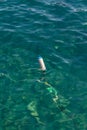 Puerto de la Cruz - popular tourist attraction and favorite place for the locals. Small floating buoy as an anchor for small