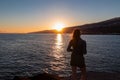 Puerto de la Cruz - Rear view of silhouette of woman watching the sunrise at port of Puerto de la Cruz Royalty Free Stock Photo