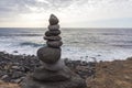 Puerto de la Cruz. Stone piles Cairns on Playa Jardin, Peurto de la Cruz, Tenerife, Canary Islands, Spain. Selfmade rock-monume