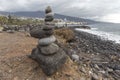 Puerto de la Cruz. Stone piles Cairns on Playa Jardin, Peurto de la Cruz, Tenerife, Canary Islands, Spain. Selfmade rock-monume