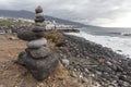 Puerto de la Cruz. Stone piles Cairns on Playa Jardin, Peurto de la Cruz, Tenerife, Canary Islands, Spain. Selfmade rock-monume