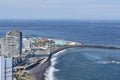 Views from Mirador de la Paz towards Puerto de la Cruz featuring hotels, a black sand beach and the water park Lago Martianez