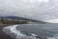 Puerto de la Cruz, Tenerife, Canary Islands - view of colorful houses, sea and volcanic-sand beach. Black beach in tenerife Royalty Free Stock Photo