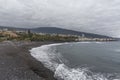 Puerto de la Cruz, Tenerife, Canary Islands - view of colorful houses, sea and volcanic-sand beach. Black beach in tenerife Royalty Free Stock Photo