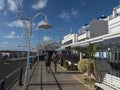 Puerto de las Nieves, Agaete, Gran Canaria, Canary Islands, Spain December 17, 2020: Two man tourist at street by sea Royalty Free Stock Photo