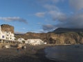 Puerto de las Nieves, Agaete, Gran Canaria, Canary Islands, Spain December 20, 2020: View of the volcanic pebble beach Royalty Free Stock Photo