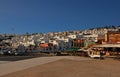 Puerto del Carmen old town centre square with whitewash houses along the hill towards the evening, Lanzarote island, Spain