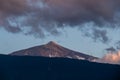 Puerto der la Cruz - Panoramic view on the peak of volcano Pico del Teide during sunset seen from the port of Puerto de la Cruz Royalty Free Stock Photo