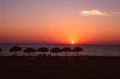 Puerto Escondido, Mexico: Sun setting over the ocean with moon already in the sky Royalty Free Stock Photo