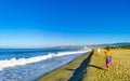 Sun beach people waves and boats in Puerto Escondido Mexico