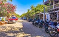 Colorful tourist street people stores restaurants bar La Punta Zicatela