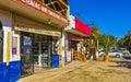 Colorful tourist street people stores restaurants bar La Punta Zicatela