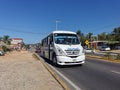 Various colorful buses tour bus transport in Puerto Escondido Mexico