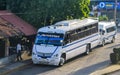 Various colorful buses tour bus transport in Puerto Escondido Mexico