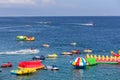 Puerto Galera, Sabang, Philippines - April 4, 2017:  Inflatable attractions, jet ski, boats and tourists having fun in the sea on Royalty Free Stock Photo