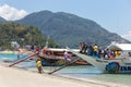 Puerto Galera, Sabang, Philippines - April 4, 2017: Passengers tourists on boats in White beach.