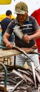 Man prepares freshly caught fish for market Royalty Free Stock Photo