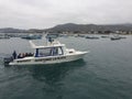 Puerto Lopez, Ecuador, 9-7-2019: A whale watching boat with tourists returning from watching whales