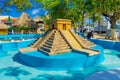 Puerto Morelos, Mexico - January 10, 2018: Beautiful outdoor view of stoned empty fountain of pyramid of yucatan in the