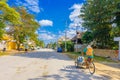 Puerto Morelos, Mexico - January 10, 2018: Unidentified man driving his tricycle in the streets of Puerto Morelos