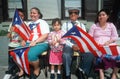 A Puerto Rican family with their national flag
