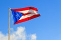 Puerto Rican flag against a blue sky