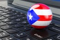 Puerto Rican flag on laptop keyboard. Online business, education, shopping in Puerto Rico concept. 3D rendering