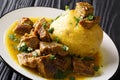 Puerto Rican Mofongo made from plantains, garlic and chicharron served with meat and broth close-up. horizontal Royalty Free Stock Photo