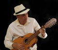 Puerto Rico Cuatro Player with a Panama hat.