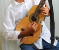 Puerto Rico Cuatro Player with white shirt.