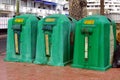 Green Spanish garbage recycle containers.