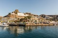 Puerto Rico, Gran Canaria - December 12 2017: Marina of Puerto Rico, a very popular travel destination. Boats, cars and