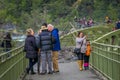 PUERTO VARAS, CHILE, SEPTEMBER, 23, 2018: Tourists walking over a bridge close to los Saltos de Pertrohue, in Chile