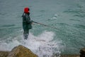 PUERTO VARAS, CHILE, SEPTEMBER, 23, 2018: Unidentified fisherman standing in a rock with a fishing rod on chilean