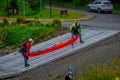 PUERTO VARAS, CHILE, SEPTEMBER, 23, 2018: Unidentified group of men holding a kayack in their hands in Puerto Varas Royalty Free Stock Photo