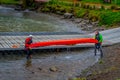 PUERTO VARAS, CHILE, SEPTEMBER, 23, 2018: Unidentified group of men holding a kayack in their hands in Puerto Varas Royalty Free Stock Photo