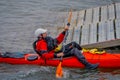 PUERTO VARAS, CHILE, SEPTEMBER, 23, 2018: Unidentified man on orange kayak enjoying the day in the water in Puerto Varas