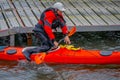 PUERTO VARAS, CHILE, SEPTEMBER, 23, 2018: Unidentified man on orange kayak enjoying the day in the water in Puerto Varas