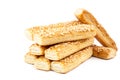 Puff biscuits with sesame seeds on white background.