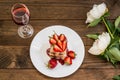 Puff cake with cream, chocolate and strawberry, on a wooden table. Top view. Close-up Royalty Free Stock Photo