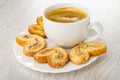 Puff cookies with poppy, black coffee in cup on plate on wooden table Royalty Free Stock Photo