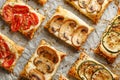 Puff pastry appetizers with vegetables; mushrooms, tomatoes and zucchini