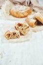Puff pastry apple filling pie on the table on a light background. Royalty Free Stock Photo