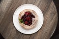 Puff pastry cake with berries on wooden background