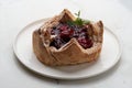 Puff pastry cake with berries on wooden background