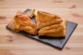 Puff pastry with cheese on slate plate