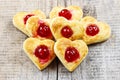 Puff pastry cookies in heart shape filled with cherries Royalty Free Stock Photo