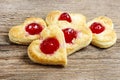 Puff pastry cookies in heart shape filled with cherries