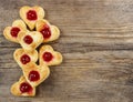 Puff pastry cookies in heart shape filled with cherries Royalty Free Stock Photo