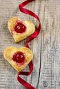 Puff pastry cookies in heart shape filled with cherries Royalty Free Stock Photo